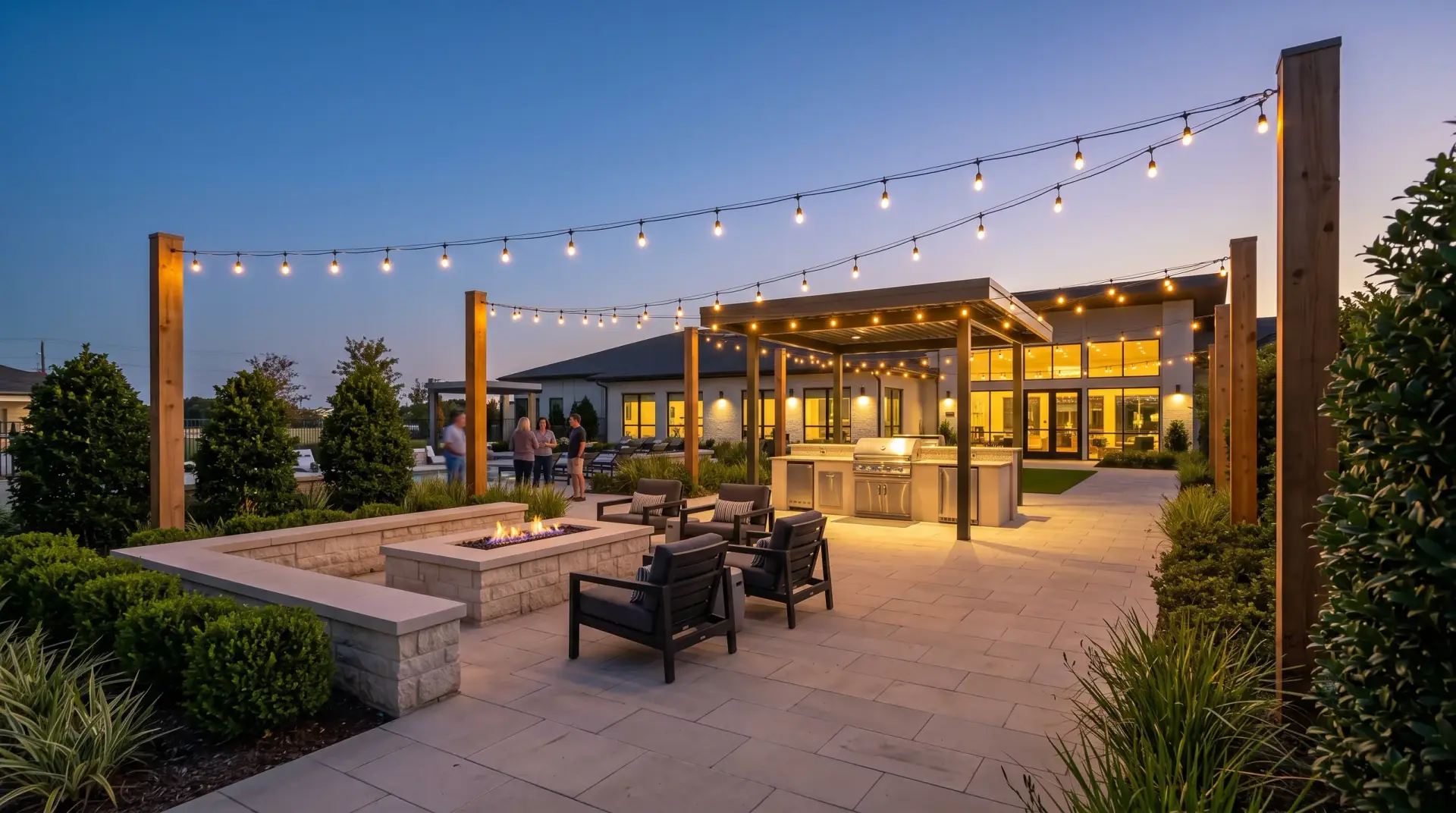A clubhouse terrace under string lights in the evening